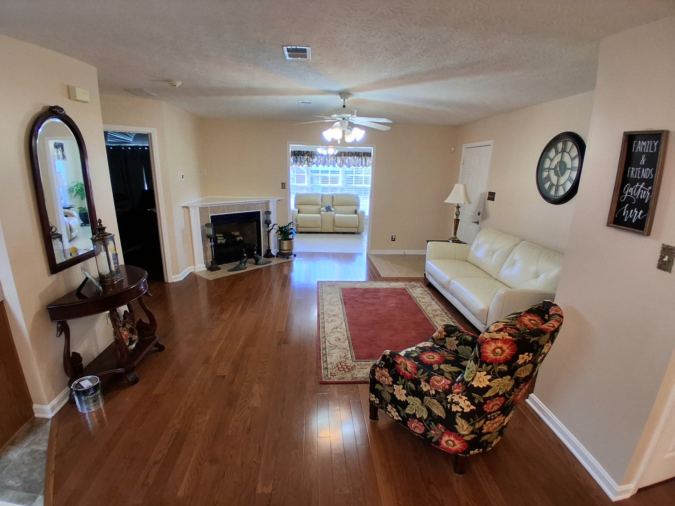 Living room with fireplace and beige walls